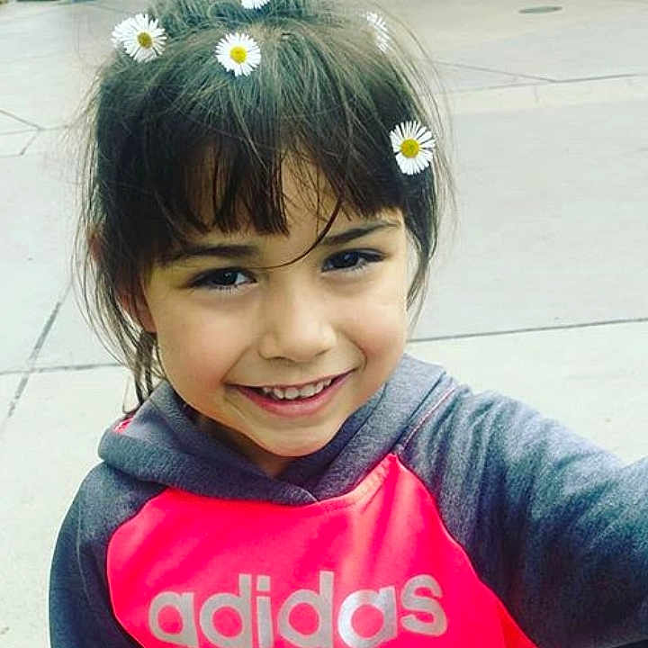 Elizabeth is registered to the contest to win money with this photo: bangs, black_hair, cheek, child, chin, ear, face, facial_expression, forehead, fun, hair, hair_accessory, hairstyle, happy, head, joy, long_hair, person, skin, smile