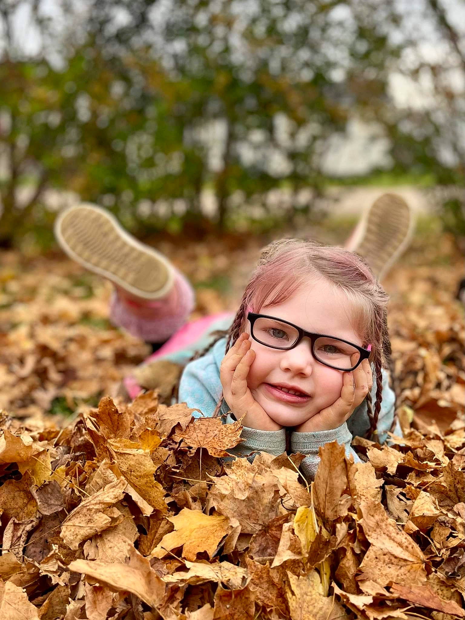 Harmony is registered to the contest to win money with this photo: adaptation, brown_hair, child, deciduous, eyewear, forest, glasses, grass, happy, hat, leisure, natural_landscape, people_in_nature, person, plant, soil, toddler, trunk, vision_care, wood