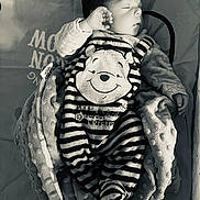 Eden participe au concours pour gagner de l'argent avec cette photo : baby, sleeping, onesie, striped_clothing, bear_face, blanket, soft_texture, infant, cute, cozy, nap, peaceful, monochrome, black_and_white, child, portrait, resting, cute_outfit, baby_clothes, newborn