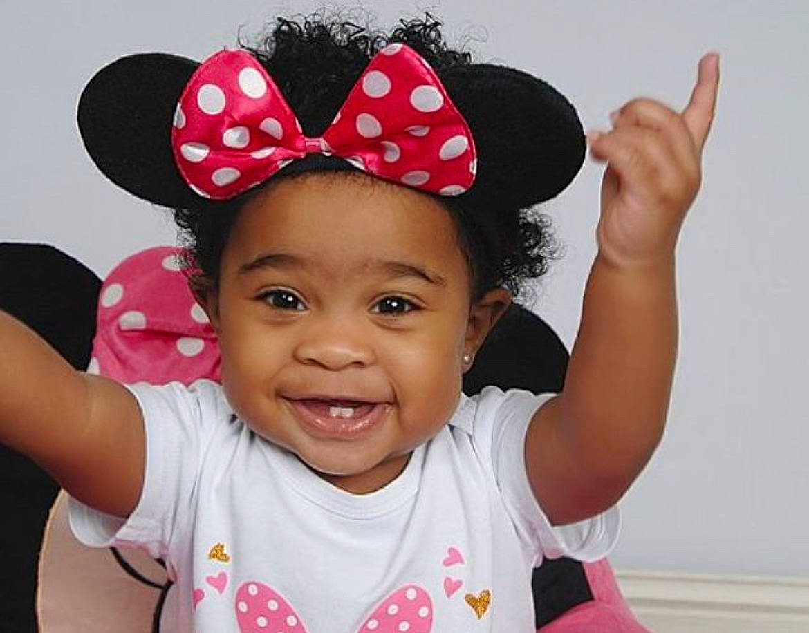 Khalani joined the competition — help win amazing prizes! baby_toddler_clothing, cap, cool, costume_hat, face, finger, fun, gesture, happy, hat, headgear, joy, lip, magenta, organ, person, pink, sleeve, smile, sun_hat