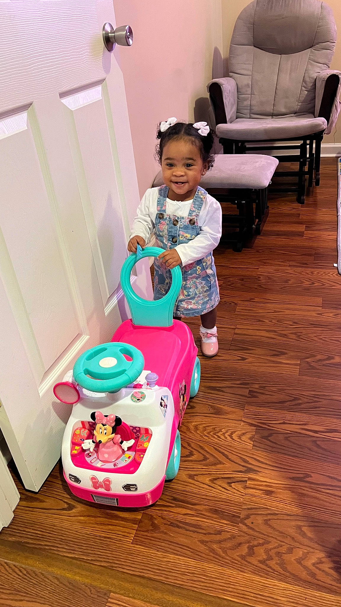 Khalani joined the competition — help win amazing prizes! baby, baby_toddler_clothing, chair, child, comfort, event, floor, flooring, fun, happy, hardwood, leisure, magenta, person, pink, riding_toy, sitting, smile, toddler, toy