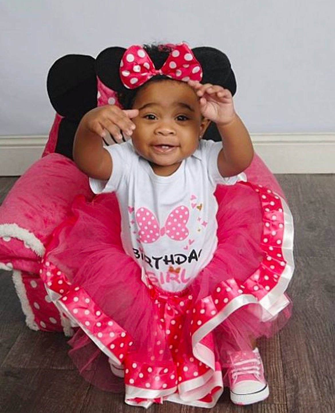 Khalani joined the competition — help win amazing prizes! baby, baby_toddler_clothing, cap, child, costume_hat, event, fashion, fashion_accessory, fun, happy, headgear, magenta, outerwear, person, pink, sitting, sleeve, smile, t_shirt, textile