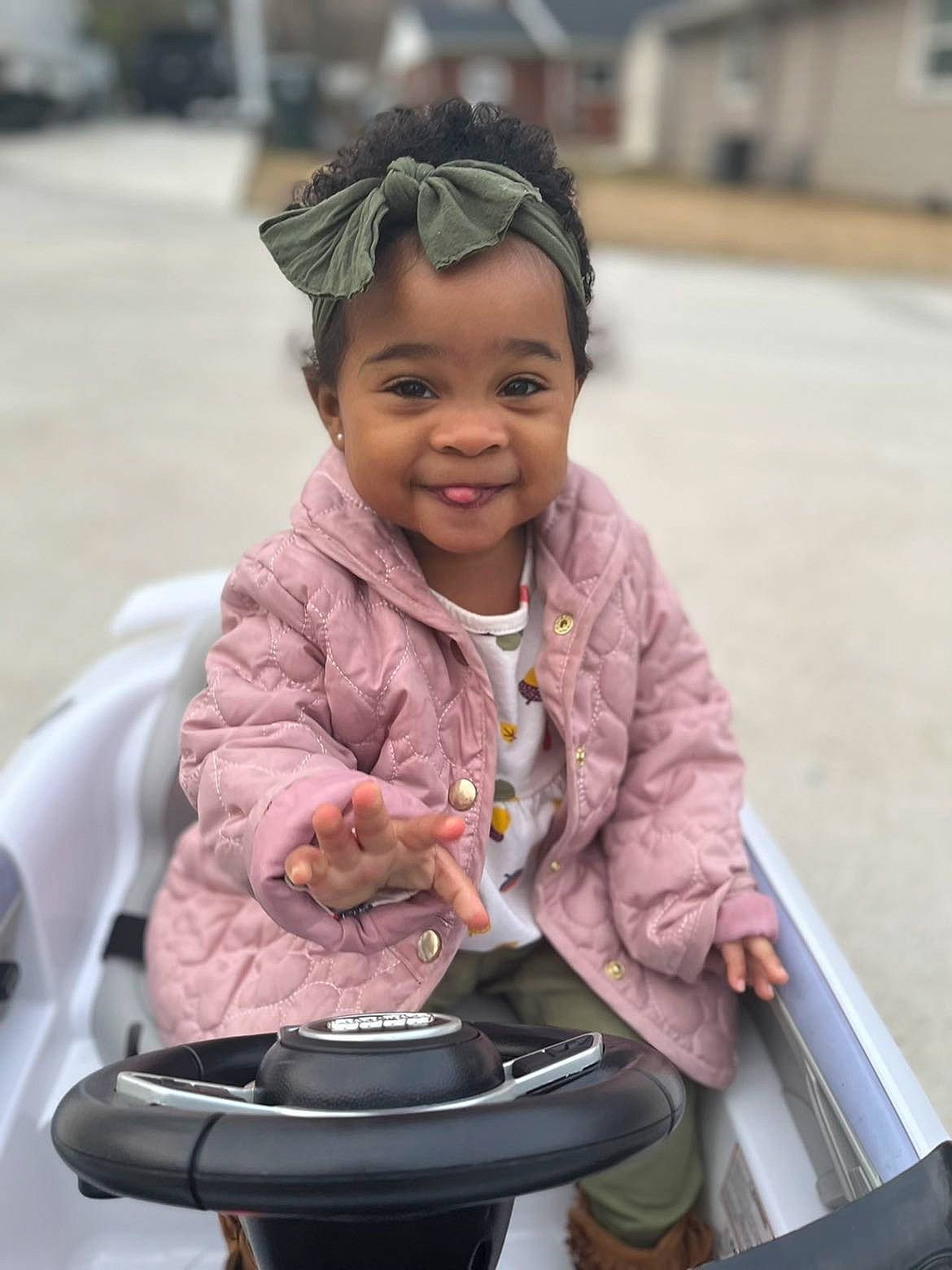 Khalani joined the competition — help win amazing prizes! baby_carriage, baby_products, child, fashion_accessory, fun, happy, joy, leisure, magenta, organ, person, personal_protective_equipment, pink, sitting, skin, smile, standing, street_fashion, tire, toddler