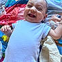 Zayn a rejoint le concours — aidez-le/la à gagner de superbes lots ! baby, blanket, cheerful, child, colorful, cute, expression, face, happy, head, indoors, infant, laughing, lying_down, onesie, playmat, skin, small_hand, smiling, soft_toy