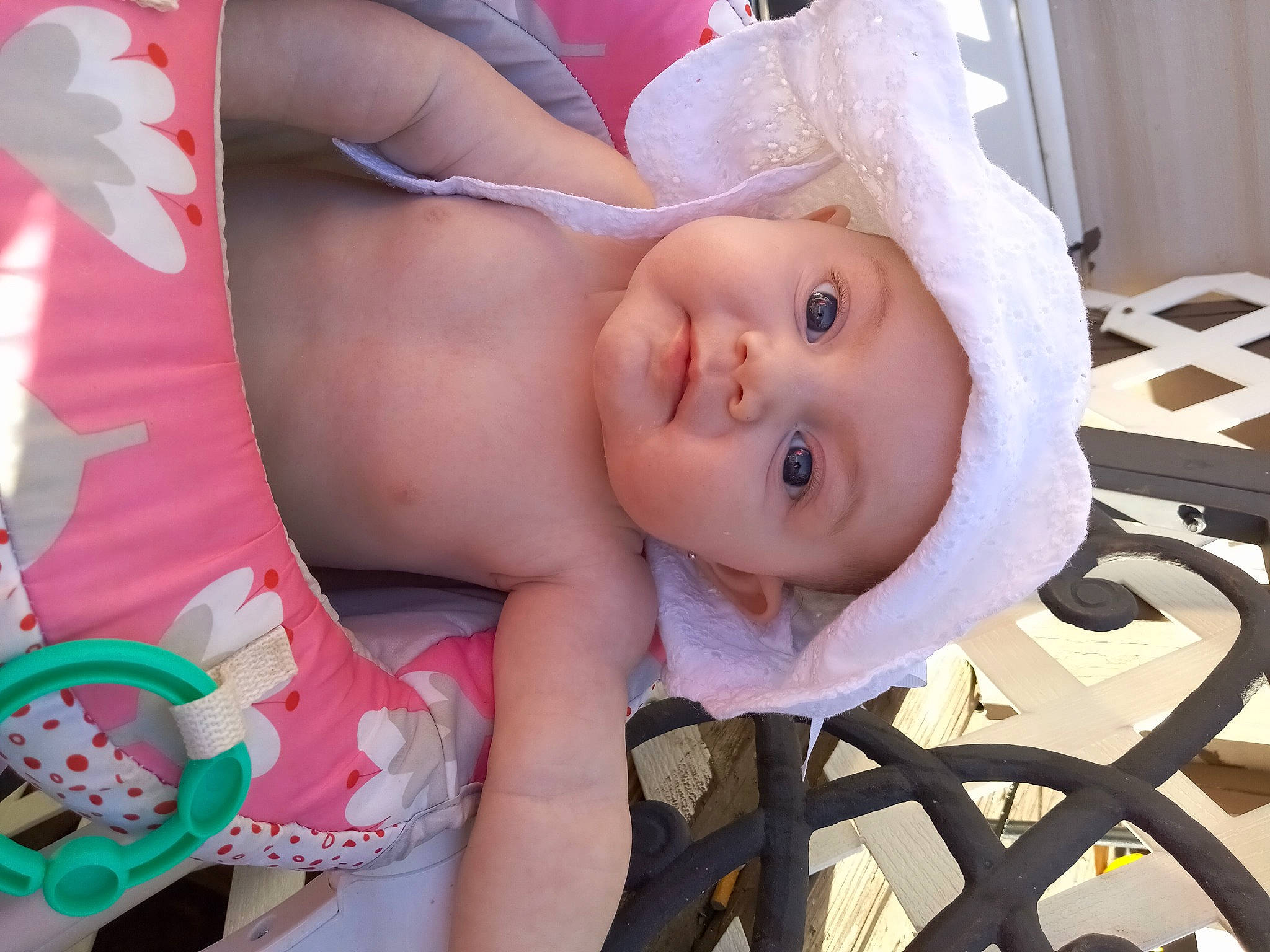 Elly is registered to the contest to win money with this photo: baby, baby_safety, baby_toddler_clothing, cheek, chest, child, eye, eyelash, happy, hat, headwear, human_body, iris, lip, mouth, person, pink, product, skin, smile