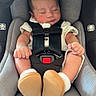 Ezekiel is registered to the contest to win money with this photo: newborn, baby, infant, sleeping, car_seat, safety_harness, portrait, rosy_cheeks, closed_eyes, chubby_cheeks, fists, feet, booties, white_clothing, indoors, vehicle, seated, cozy, adorable, photography