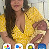 Sienna joined the competition — help win amazing prizes! app_icons, baby, child, clock, facebook, family, heart_necklace, holding_baby, indoor, mother, newborn, peaceful, phone_screen, photographs, portrait, seated, sleeping, smartphone_screenshot, yellow_dress, yellow_outfit