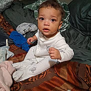 Grayson joined the competition — help win amazing prizes! baby, bed, bedding, blanket, brown_hair, child, cozy, curious, face, home, indoors, pajamas, photography, portrait, short_hair, sitting, textile, toddler, white_clothing, wide_eyed