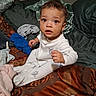 baby, bed, bedding, blanket, brown_hair, child, cozy, curious, face, home, indoors, pajamas, photography, portrait, short_hair, sitting, textile, toddler, white_clothing, wide_eyed