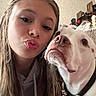 Gracie is registered to the contest to win money with this photo: woman, dog, selfie, indoor, face, pucker, collar, pet, animal, closeup, casual, hair, expression, friendship, loyalty, cute, young_adult, portrait, human, companion