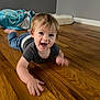 Timothy joined the competition — help win amazing prizes! toddler, child, crawling, smiling, happy, wooden_floor, indoor, blanket, mattress, gray_wall, clothing, short_hair, person, flooring, baby, playful, expression, home, young_child, bright_eyes