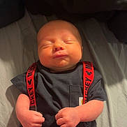 Blake joined the competition — help win amazing prizes! baby, newborn, infant, sleeping, clothing, suspenders, mickey_mouse, red, black, hands, face, portrait, cute, child, person, indoors, bed, blanket, soft_light, resting