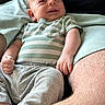 baby, infant, smiling, striped_shirt, gray_pants, barefoot, adult_lap, skin, happy, portrait, indoor, person, clothing, casual, cute, child, relaxing, comfort, closeup, human