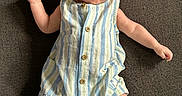 Mason is registered to the contest to win money with this photo: baby, barefoot, blue_eyes, casual_clothing, child, curious_expression, cute, head, human, indoor, infant, lying_down, one_person, portrait, romper, skin, small_fingers, small_toes, striped_clothing, textured_surface