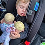 toddler, child, car_seat, sleeping, doll, toy, blonde_hair, car_interior, seatbelt, clothing, hand, face, closed_eyes, child_seat, baby_doll, infant, cute, nap, resting, car