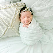 Rosie joined the competition — help win amazing prizes! newborn, baby, blanket, pillow, headband, flower, sleeping, white, soft, cozy, texture, bed, resting, peaceful, infant, cute, wrapped, portrait, indoors, comfort