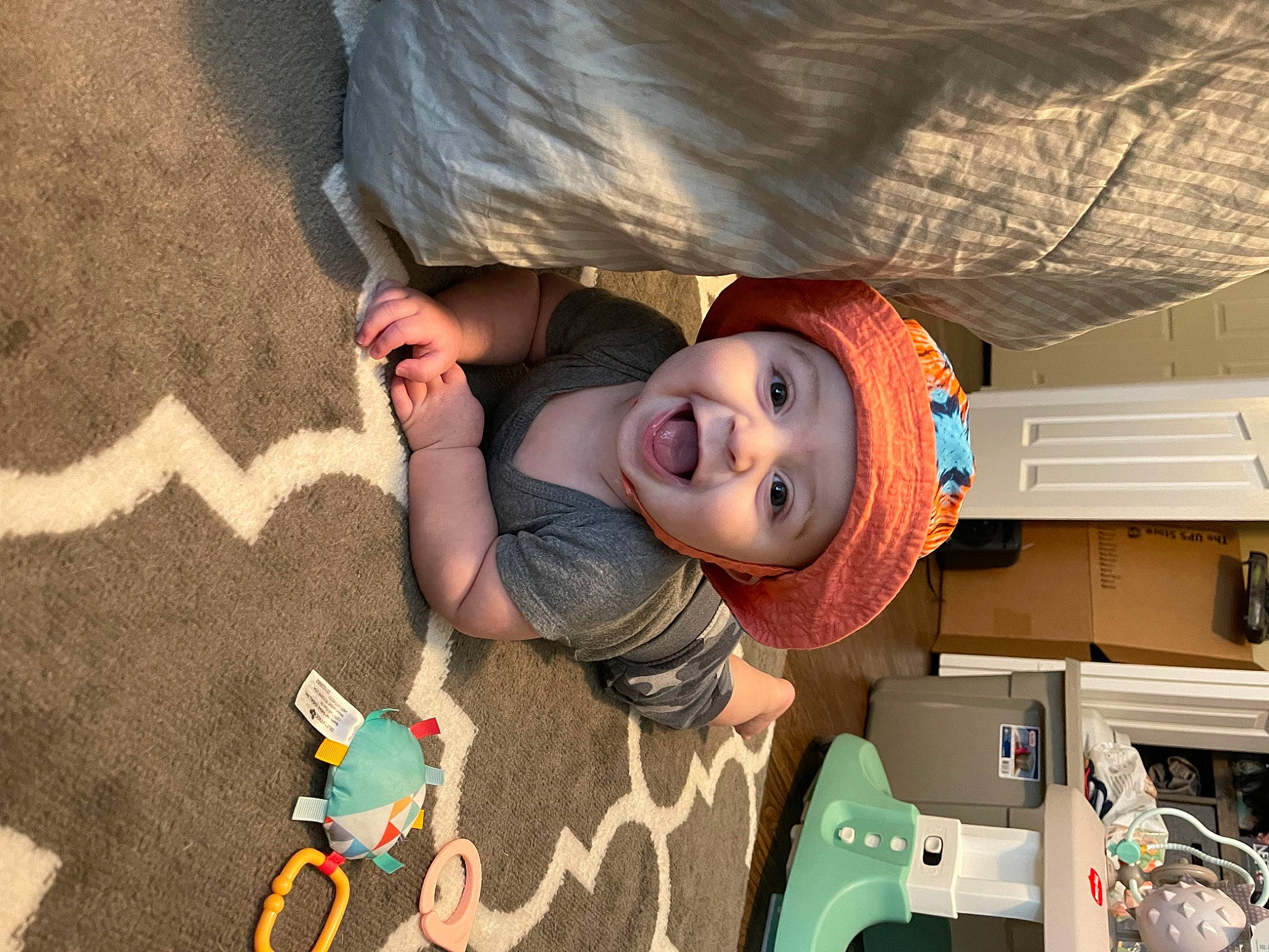 Kane joined the competition — help win amazing prizes! baby, baby_products, baby_toys, cabinetry, child, fun, hat, headwear, person, plastic, play, room, smile, t_shirt, toddler, toy, toy_vehicle, wood
