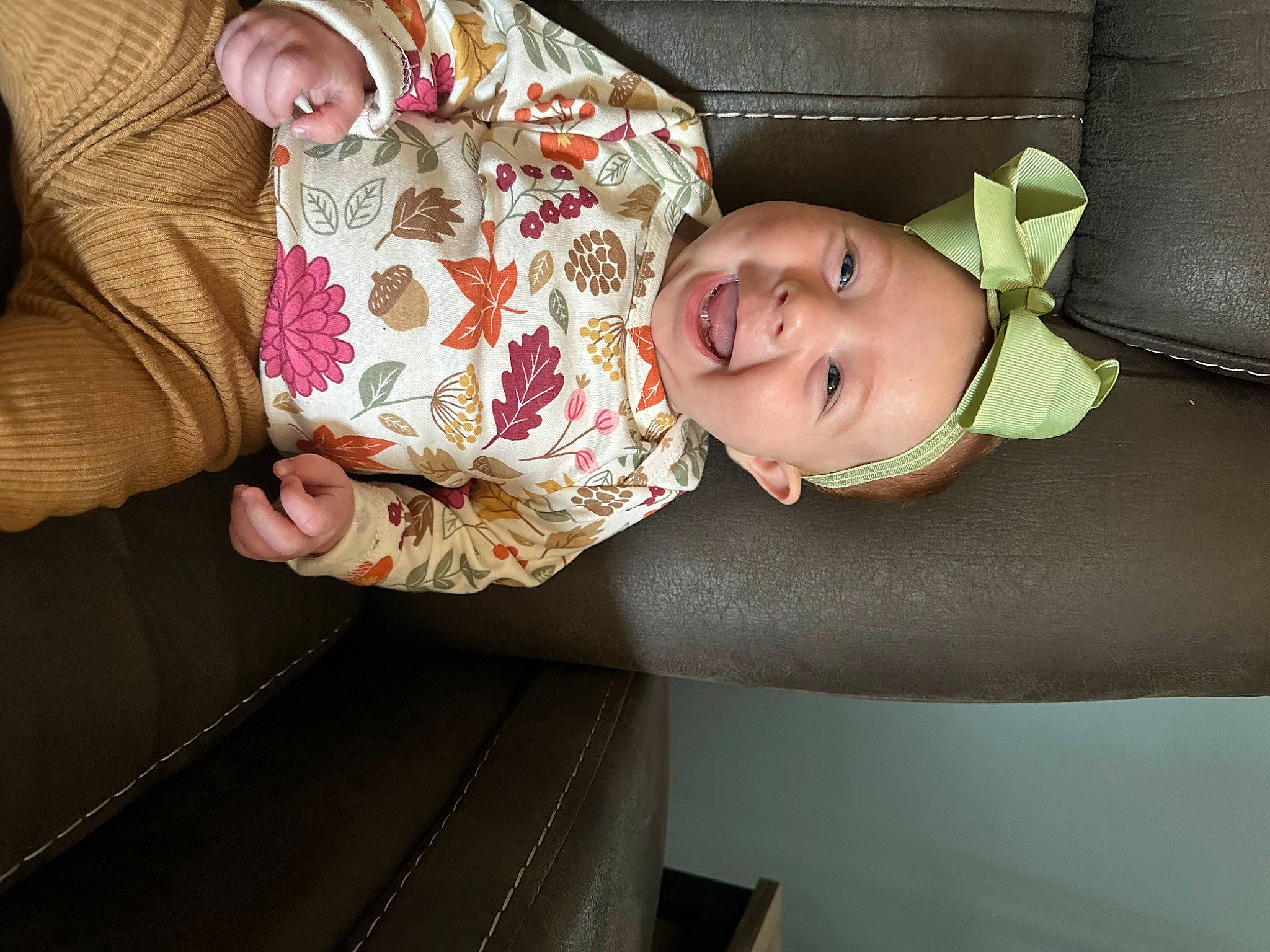 Paisley is registered to the contest to win money with this photo: baby, baby_products, baby_toddler_clothing, cheek, child, comfort, couch, finger, fun, joy, linens, pattern, person, room, sitting, sleep, sleeve, smile, toddler, wood