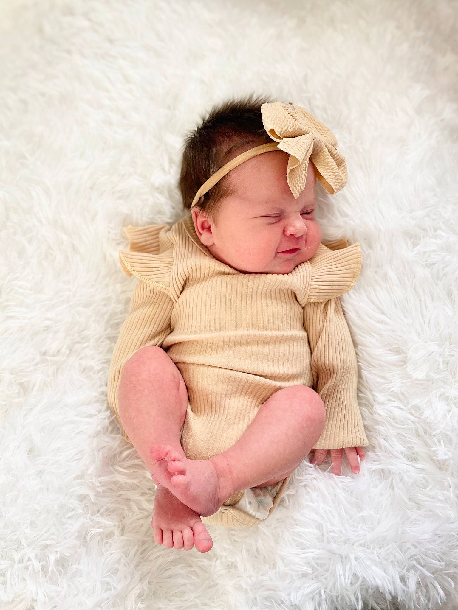 Harper joined the competition — help win amazing prizes! baby, baby_sleeping, baby_toddler_clothing, child, comfort, eye, fashion_accessory, flooring, fur, happy, headgear, headpiece, leg, linens, lip, pattern, peach, person, sitting, sleeve