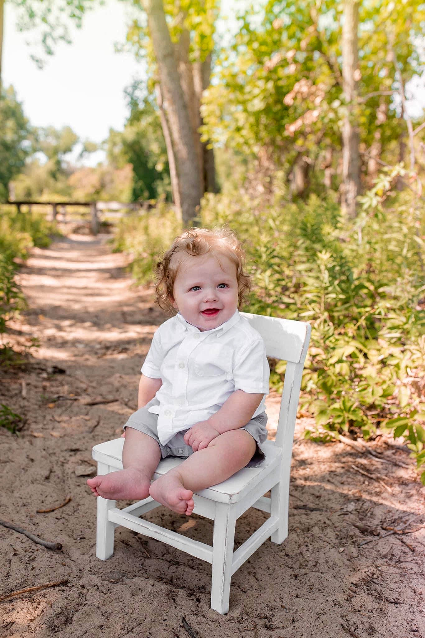 Devin Jr is registered to the contest to win money with this photo: baby, baby_toddler_clothing, chair, forest, fun, garden, grass, happy, leisure, people_in_nature, person, plant, recreation, sitting, soil, summer, sunlight, toddler, tree, wood