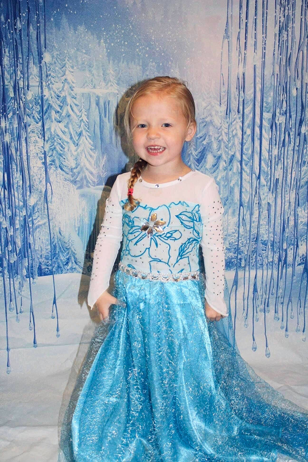 Amelia is registered to the contest to win money with this photo: azure, baby_toddler_clothing, blue, clothing, day_dress, dress, eye, face, fashion, hair, happy, head, iris, joy, one_piece_garment, person, skin, sleeve, smile, standing