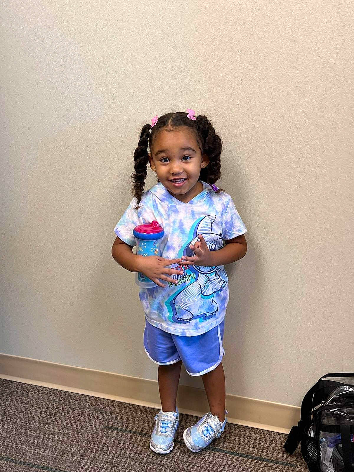 Makayla is registered to the contest to win money with this photo: arm, baby_toddler_clothing, backpack, bag, black_hair, clothing, electric_blue, fashion_design, fun, happy, joint, joy, luggage_and_bags, magenta, person, purple, shorts, sleeve, smile, standing