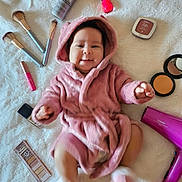 Emaellis joined the competition — help win amazing prizes! baby, beauty_products, blanket, child, cosmetics, cute, face, hair_dryer, indoor, infant, lying_down, makeup_brushes, nail_polish, person, pink_robe, playful, skin_care, small_feet, smiling, soft_texture