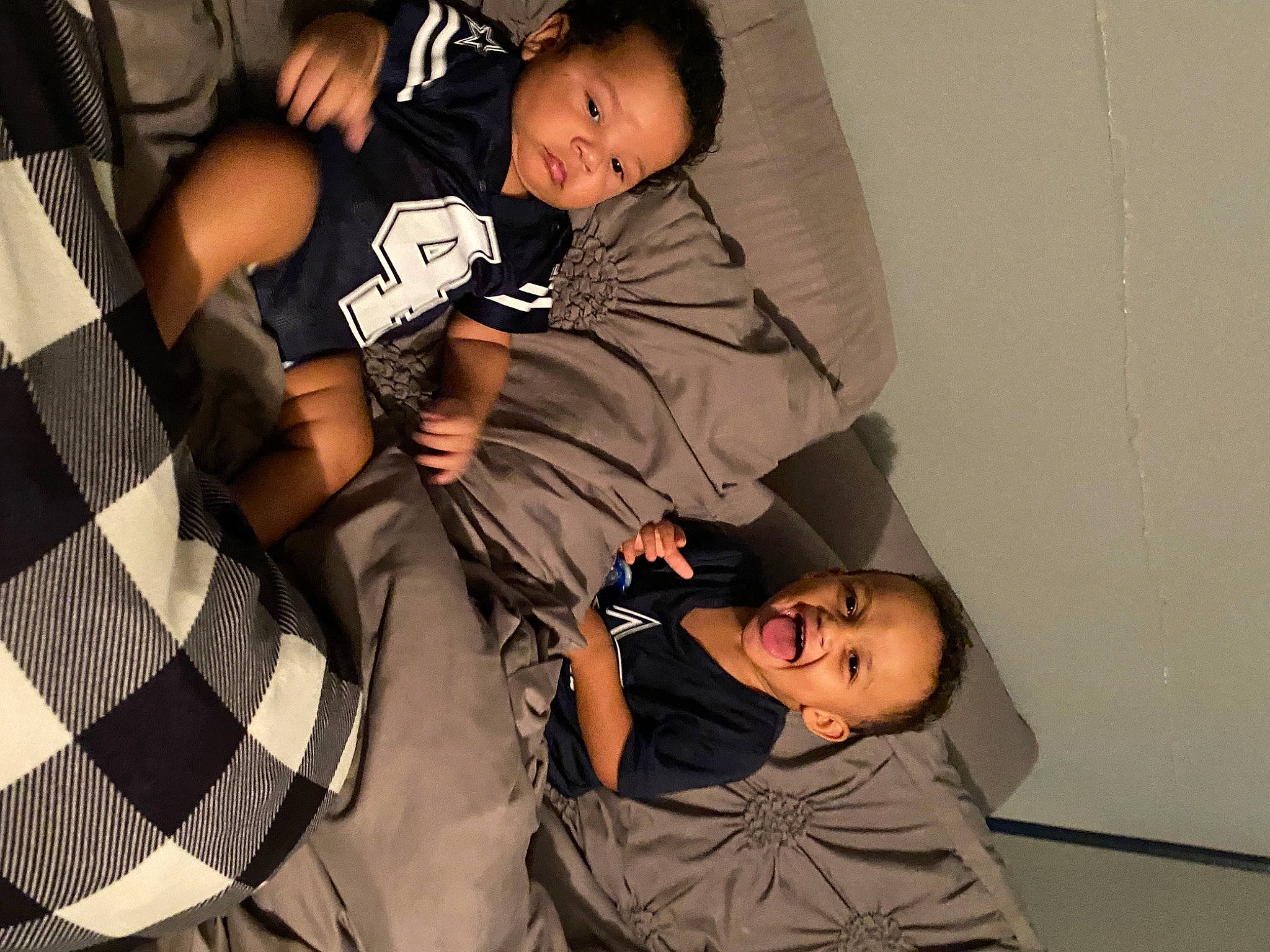 Dion joined the competition — help win amazing prizes! baby, black, black_hair, child, comfort, elbow, event, fashion_design, flash_photography, foot, fun, gesture, happy, knee, pattern, person, room, sitting, t_shirt, thigh