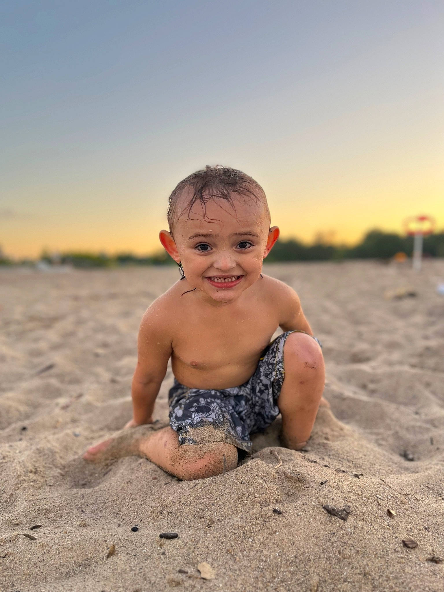 Lorenzo is registered to the contest to win money with this photo: baby, barechested, beach, child, flash_photography, fun, happy, horizon, joy, landscape, leisure, ocean, people_in_nature, people_on_beach, person, rock, sand, sitting, sky, smile