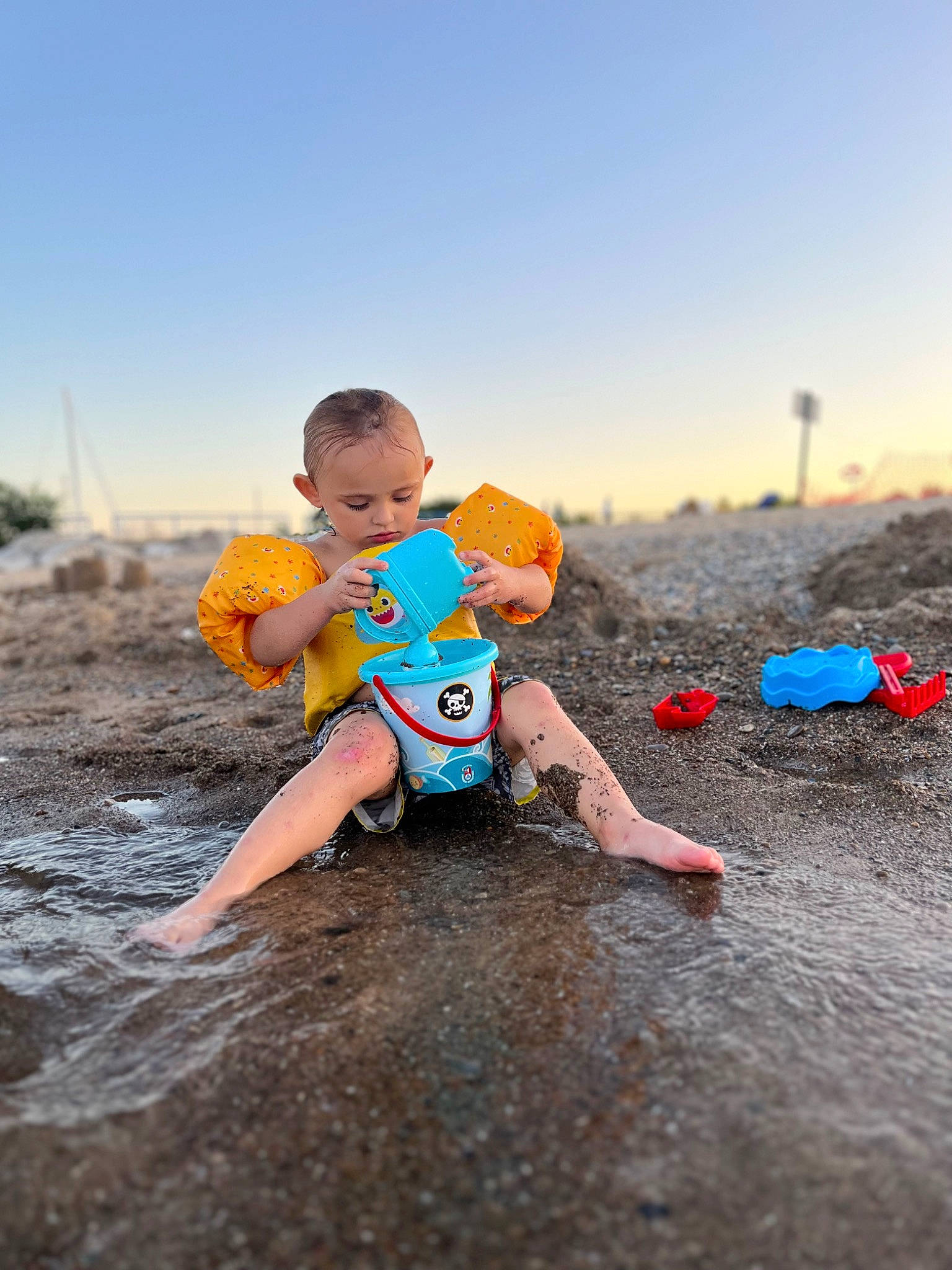 Lorenzo is registered to the contest to win money with this photo: baby, beach, child, cloud, fun, happy, hat, horizon, landscape, leisure, people_in_nature, people_on_beach, person, personal_protective_equipment, recreation, sand, shore, sky, toddler, water