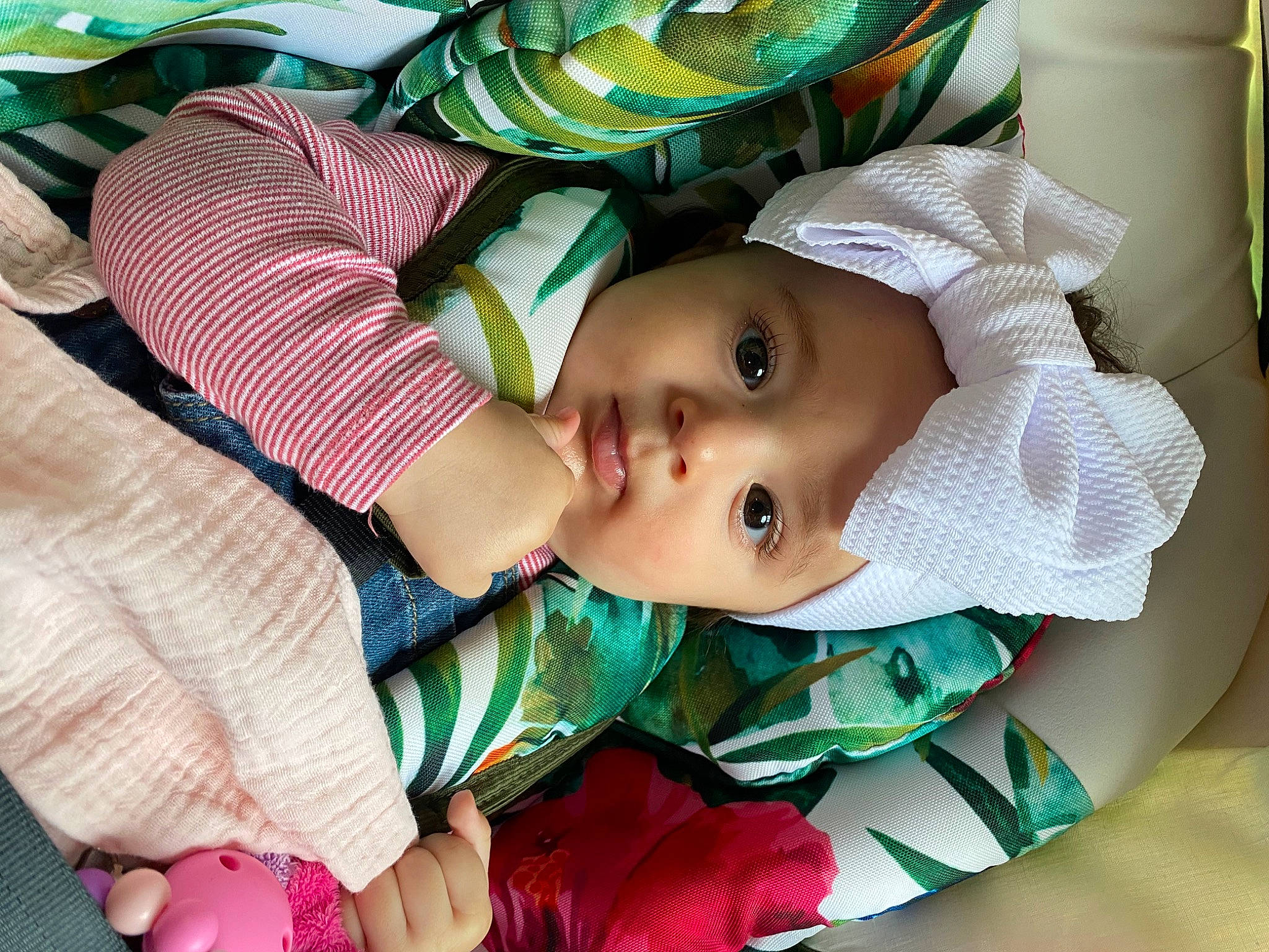 Tess participe au concours pour gagner de l'argent avec cette photo : baby, baby_products, baby_safety, baby_toddler_clothing, cheek, child, comfort, eye, eyelash, green, happy, hat, head, headwear, iris, linens, pattern, person, skin, sleeve