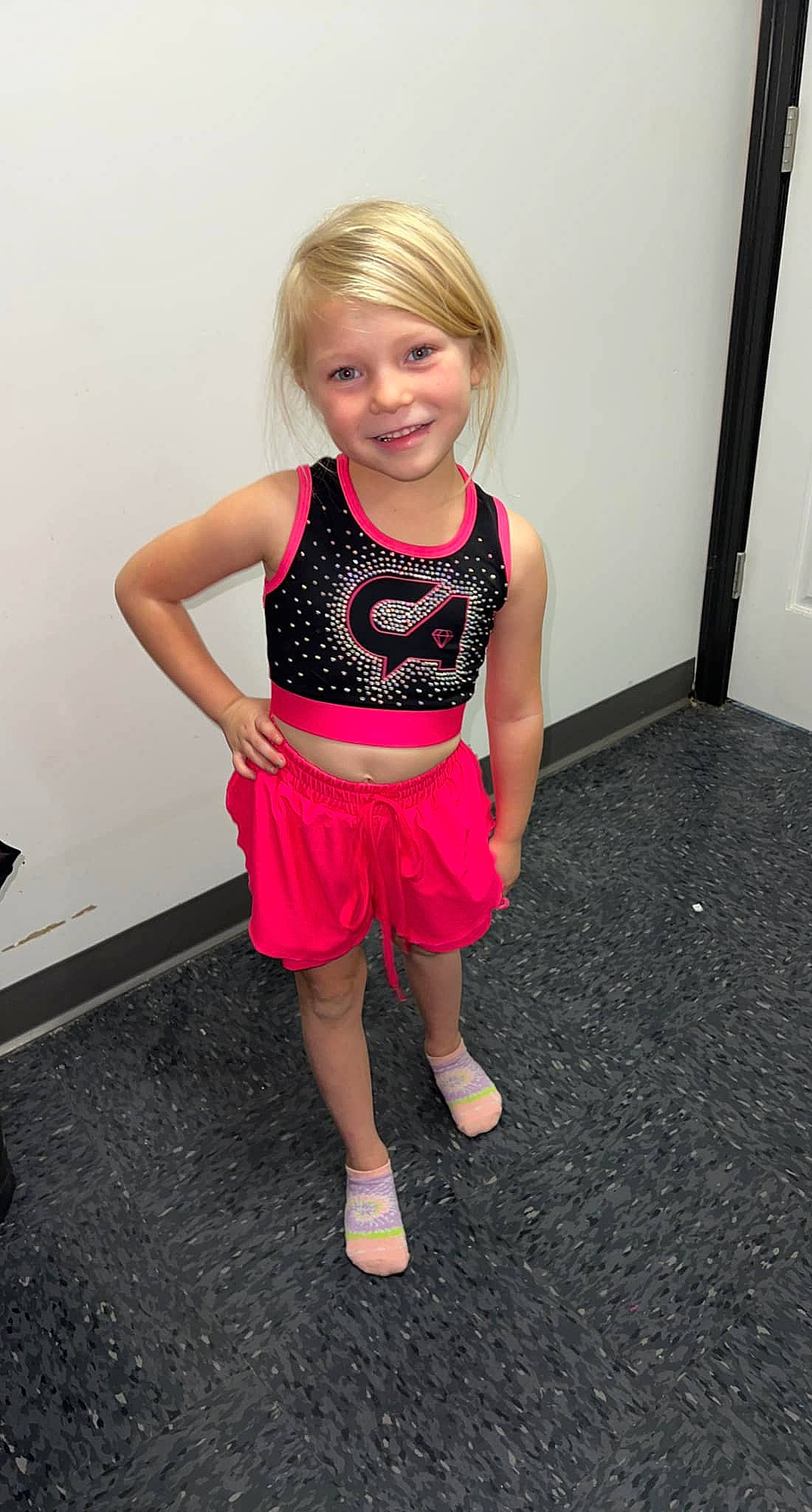 Paisley is registered to the contest to win money with this photo: abdomen, baby_toddler_clothing, electric_blue, face, fashion_design, happy, human_leg, joy, knee, leg, magenta, pattern, person, pink, sleeve, smile, sportswear, t_shirt, thigh, toddler