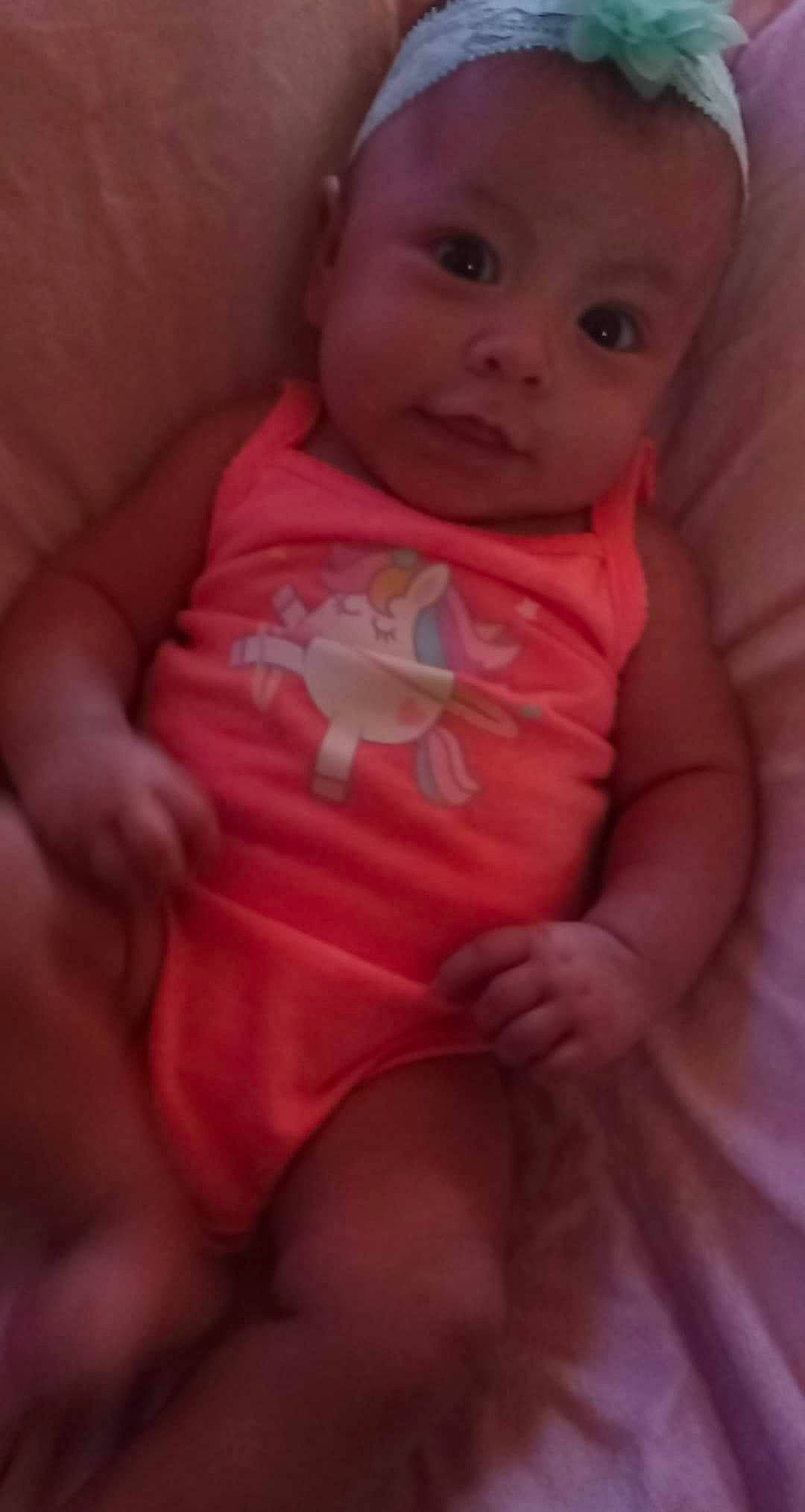 Emaree is registered to the contest to win money with this photo: baby, birth, cheek, child, eye, face, finger, hand, head, iris, lip, mouth, nose, person, pink, skin, smile, thumb, toddler