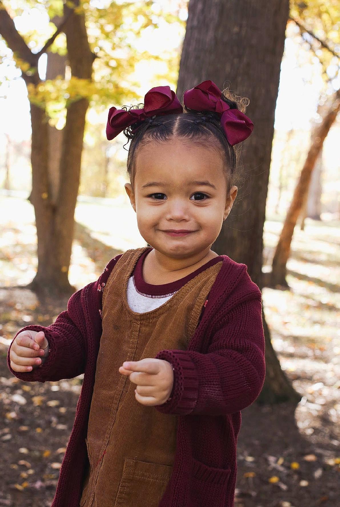 Brylee is registered to the contest to win money with this photo: baby_toddler_clothing, child, facial_expression, flash_photography, fun, gesture, grass, happy, joy, leisure, lip, magenta, people_in_nature, person, plant, skin, sleeve, smile, standing, toddler