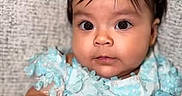 Catalina joined the competition — help win amazing prizes! baby, child, portrait, sitting, turquoise_dress, white_bow, headband, frilly_clothing, wide_eyes, serious_expression, infant, face, hands, indoor, fabric_backdrop, close_up, adorable, photography, formal_outfit, baby_dress
