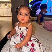 Catalina joined the competition — help win amazing prizes! child, toddler, baby, girl, boy, portrait, sitting, couch, dress, floral_pattern, shoes, sparkly_shoe, hair_bows, smiling, indoors, living_room, kitchen, television, furniture, family
