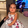 child, toddler, baby, girl, boy, portrait, sitting, couch, dress, floral_pattern, shoes, sparkly_shoe, hair_bows, smiling, indoors, living_room, kitchen, television, furniture, family