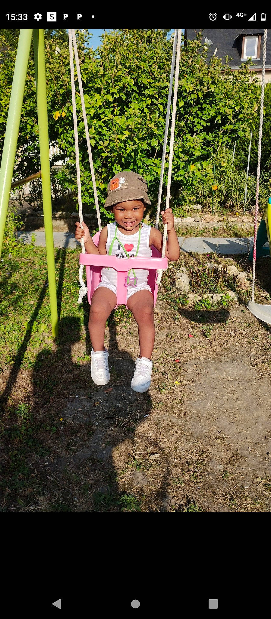 Gabrielle participe au concours pour gagner de l'argent avec cette photo : baby_toddler_clothing, child, city, fun, grass, happy, headwear, joy, jungle, leisure, outdoor_play_equipment, people_in_nature, person, plant, playground, recreation, shorts, smile, soil, swing