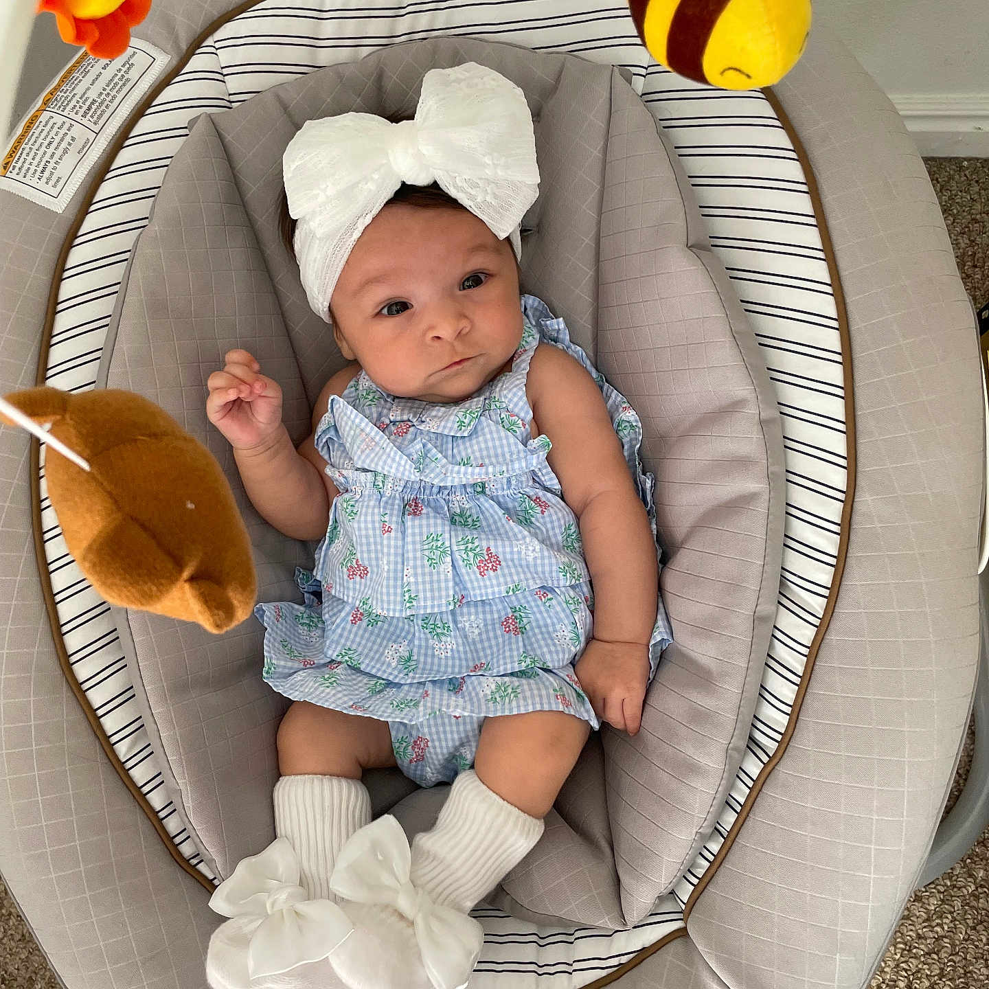 Emma Peña Bello joined the competition — help win amazing prizes! baby, baby_girl, baby_seat, bear_toy, bee_toy, bow, carpet, child, clothing, comfortable, cute, headband, indoor, infant, person, plush_toy, portrait, smiling, socks, soft_toys