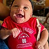 Amilyah joined the competition — help win amazing prizes! baby, child, infant, smiling, laughing, portrait, close_up, headband, cat_ears, red_shirt, onesie, sitting, indoors, home, happy, joyful, face, person, clothing, photography