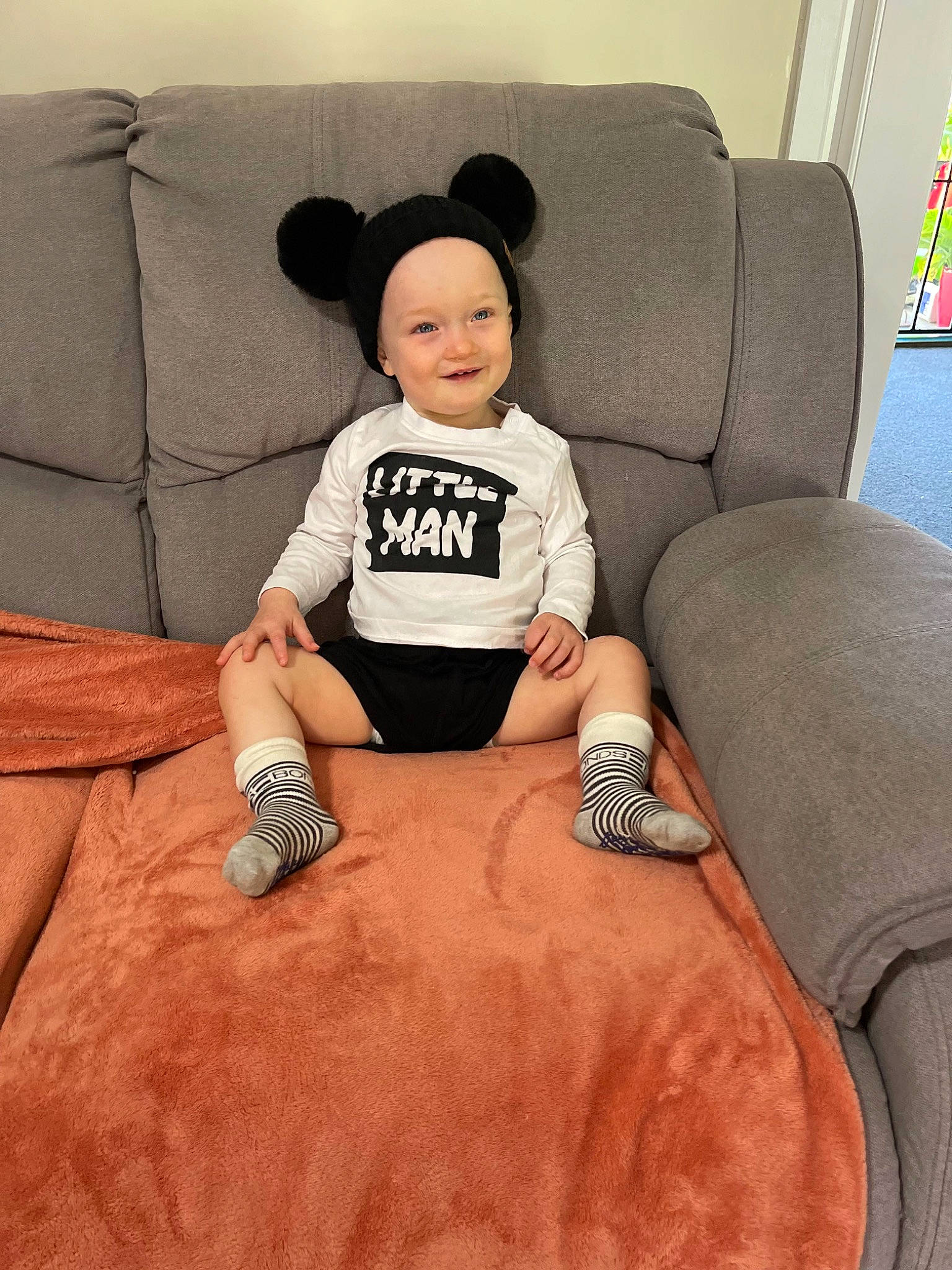 Abel joined the competition — help win amazing prizes! baby, baby_toddler_clothing, car_seat, car_seat_cover, child, comfort, family_car, flooring, hat, headwear, human_leg, joy, knee, linens, pattern, person, room, sitting, sleeve, smile