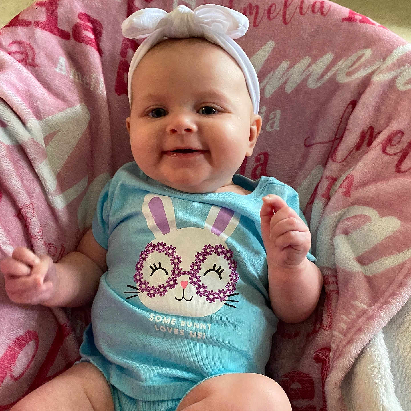 Amelia joined the competition — help win amazing prizes! baby, bed, blanket, bodypart, clothing, cushion, cutlery, face, furniture, happy, head, homedecor, newborn, person, photography, portrait, sitting, smile, spoon, t_shirt