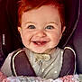 baby, smile, teeth, car_seat, blanket, crochet, clothing, child, face, head, happy, infant, mesh, pattern, portrait, seatbelt, young_child, cute, indoors, closeup