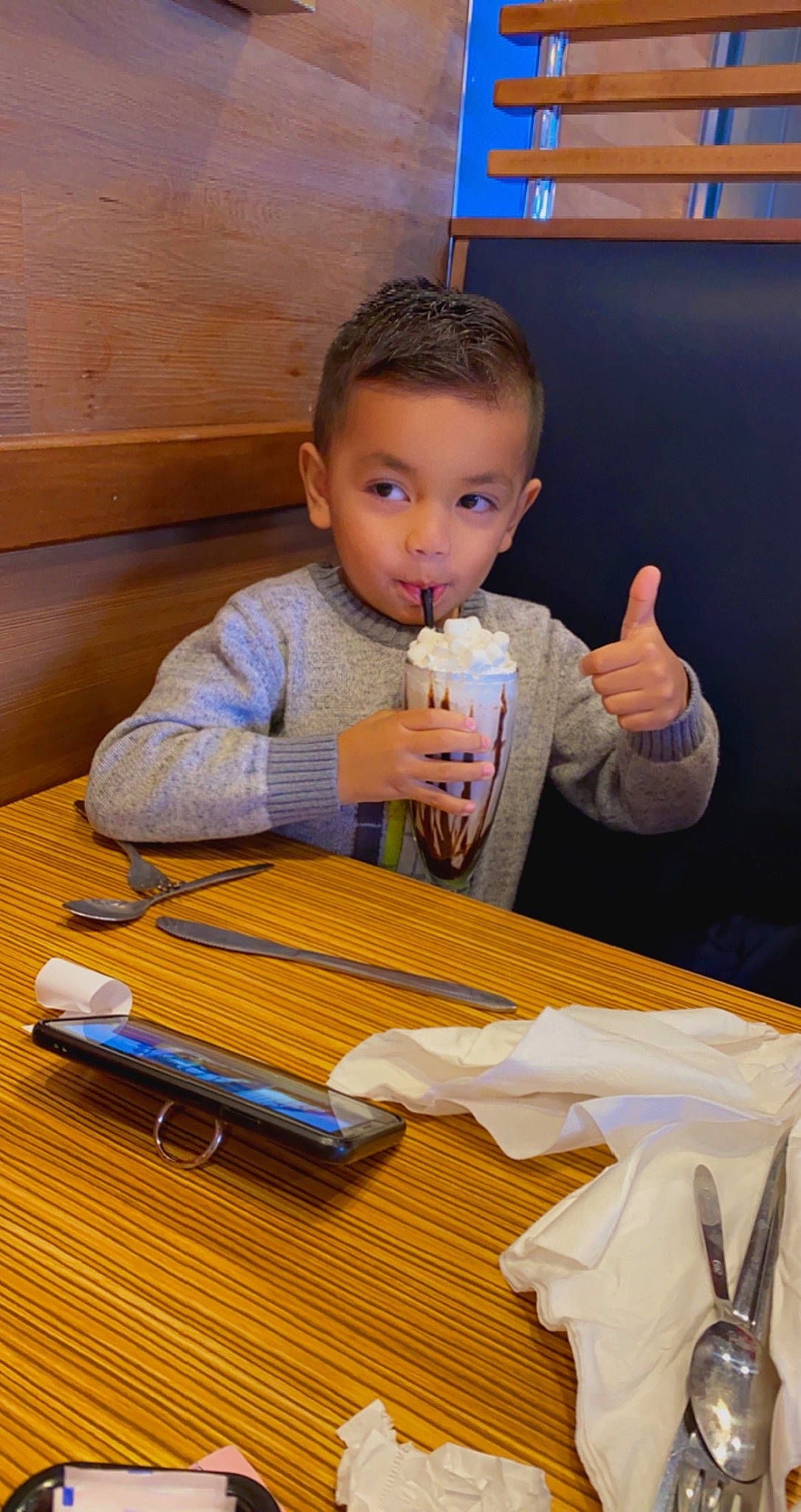 Mateo joined the competition — help win amazing prizes! chair, child, comfort_food, finger, flooring, hand, hardwood, junk_food, person, plate, play, room, sitting, t_shirt, table, tableware, thumb, toddler, varnish, wood