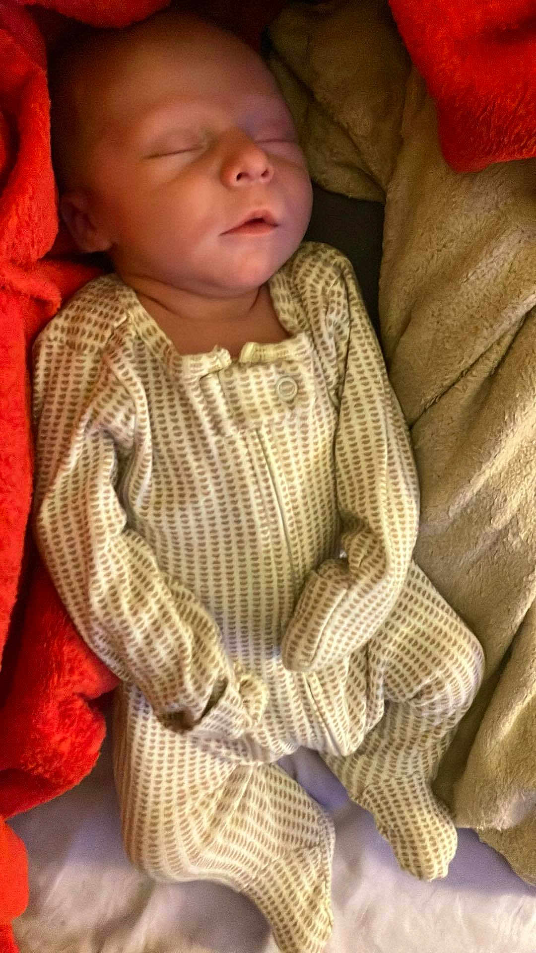 Elijah is registered to the contest to win money with this photo: baby, sleeping, newborn, pajamas, blanket, soft, cozy, infant, child, face, resting, cute, warm, bed, comfort, peaceful, portrait, clothing, indoors, relaxation