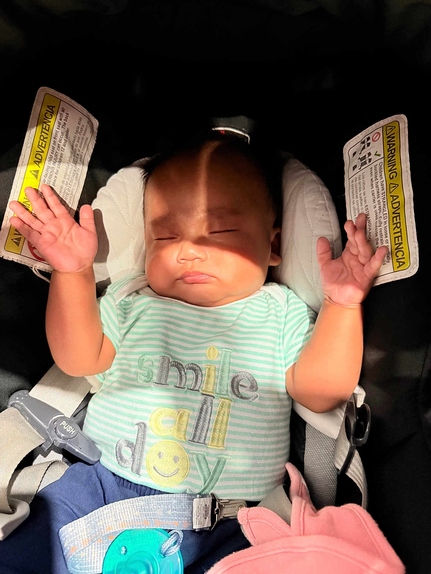 Kam is registered to the contest to win money with this photo: baby, sleeping, car_seat, shirt, striped_clothing, pacifier, shadow, hand, infant, child, seatbelt, pink_blanket, safety, closed_eyes, cute, adorable, expression, indoors, peaceful, strap