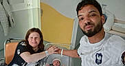 Myriam a rejoint le concours — aidez-le/la à gagner de superbes lots ! baby, bassinet, beard, bedroom, blanket, clothing, couple, family, happy, hat, holding_hands, hospital, indoor, man, newborn, parenthood, person, rest, smile, woman