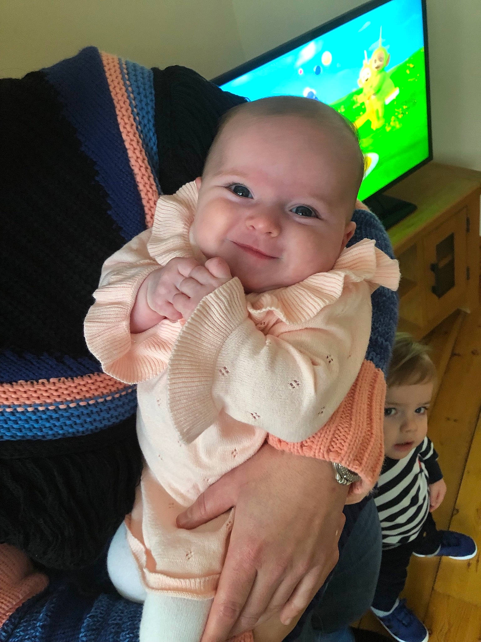 Hattie is registered to the contest to win money with this photo: baby_products, cheek, child, day, finger, girl, head, infant, iris, mouth, nose, person, product, sitting, skin, smile, toddler