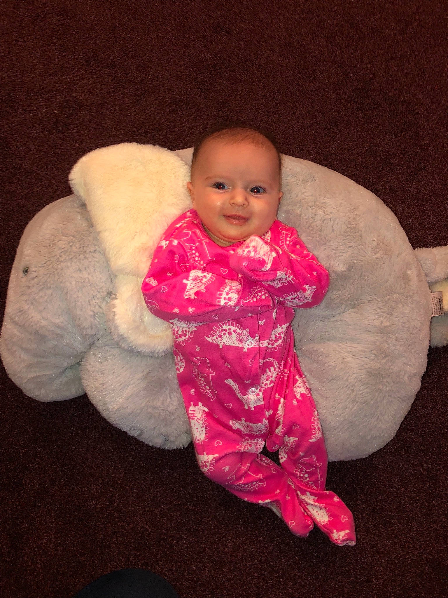 Hattie is registered to the contest to win money with this photo: child, eye, fun, girl, infant, person, pink, product, sitting, skin, smile, textile, toddler