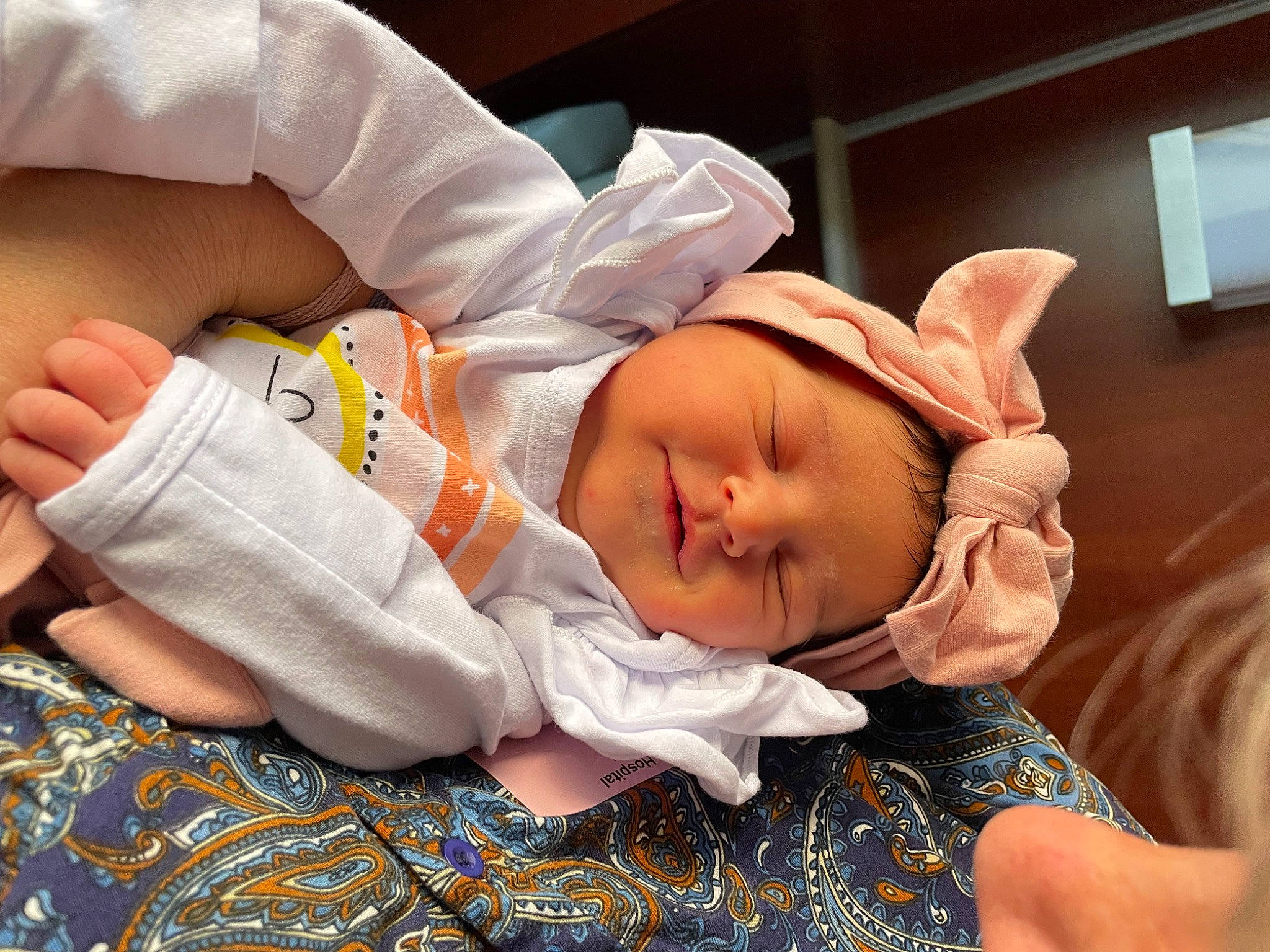 Laurel is registered to the contest to win money with this photo: abdomen, baby, baby_products, baby_sleeping, baby_toddler_clothing, bedtime, cheek, child, comfort, elbow, finger, hand, headwear, linens, mouth, nap, pattern, person, room, sleeve